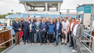 The SYNERGETICS consortium in front of the push boat Bad Deutsch-Altenburg at the closing event organised by viadonau on 10 June 2026