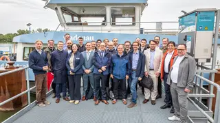 The SYNERGETICS consortium in front of the push boat Bad Deutsch-Altenburg at the closing event organised by viadonau on 10 June 2026