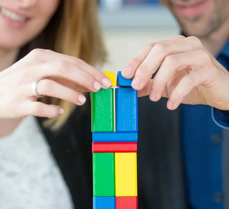 Employees playing with building blocks