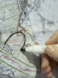 Close up, Person writes on a map